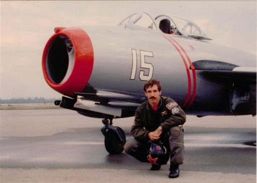 Paul Entrekin, Author of Mr. MiG, posing with his MiG on the ramp